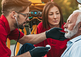 man and woman helping an elderly man
